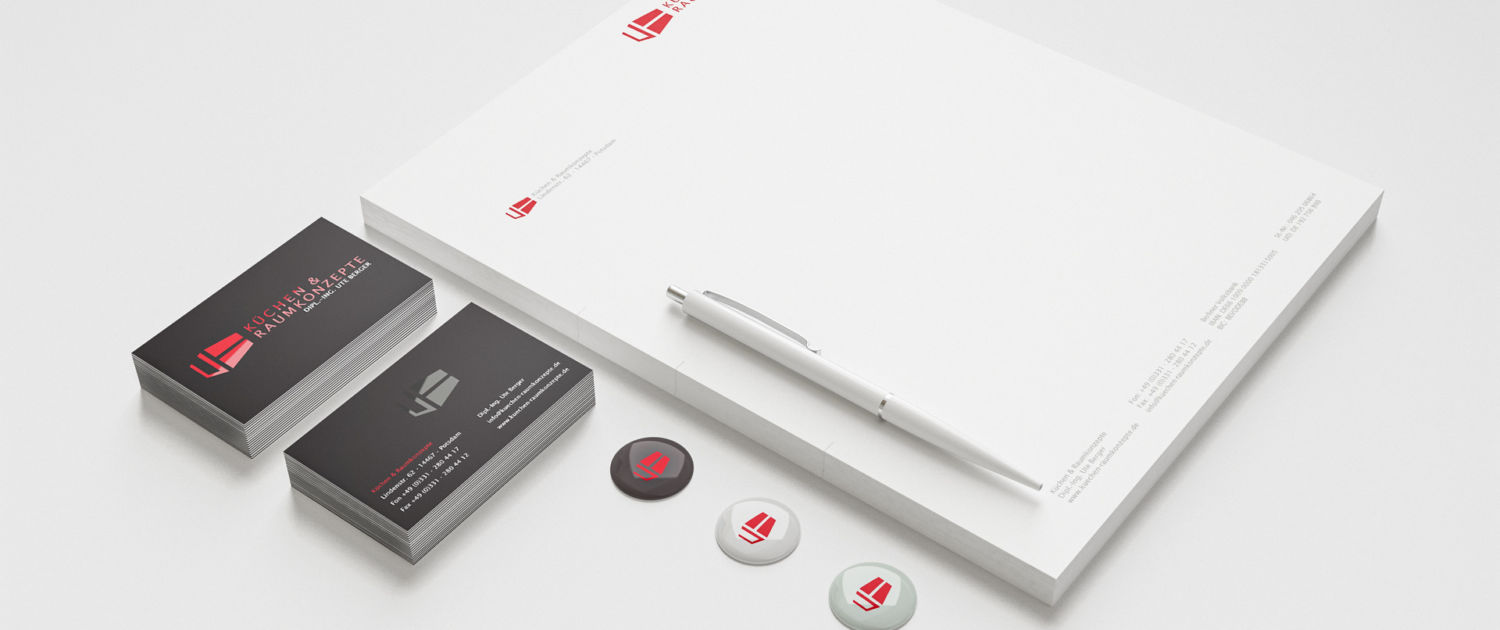 Corporate design shown on business paper, cards and buttons